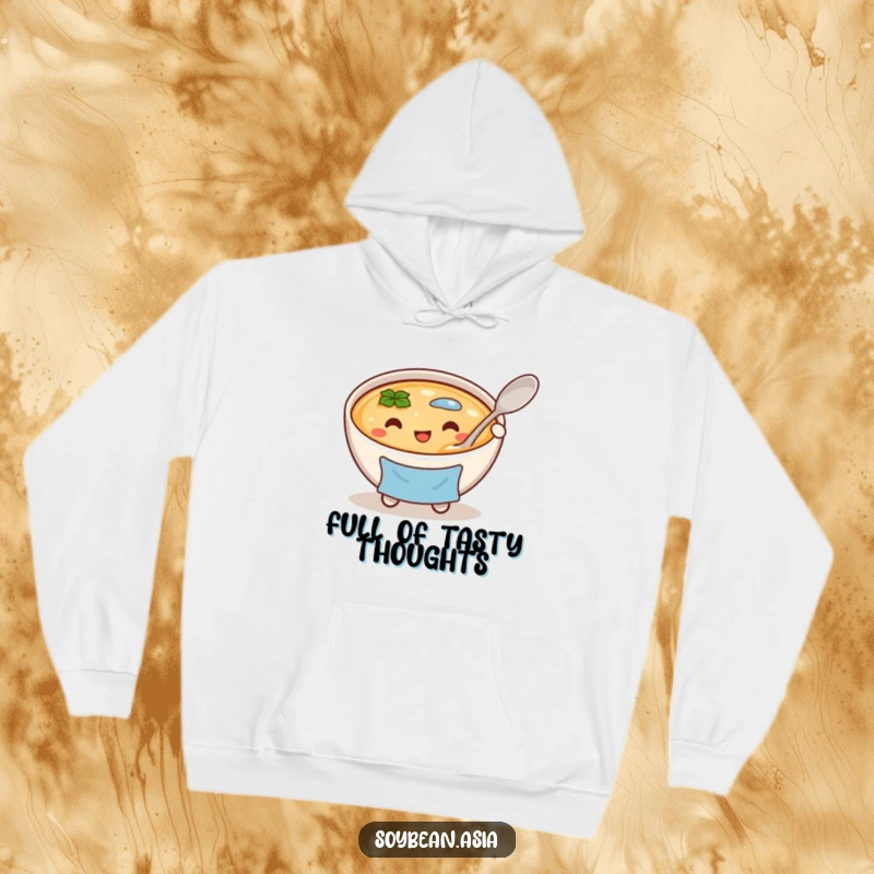 Funny, cheerful miso soup bowl character in a blue apron, holding a large spoon on a soft hoodie, for cozy days.