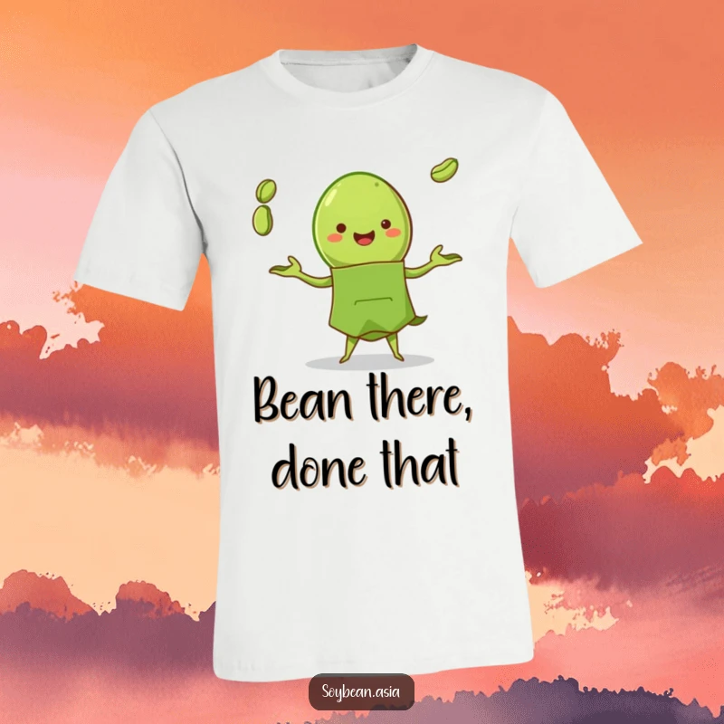 Funny edamame pod character in a green apron, joyfully juggling three beans on a soft cotton t-shirt, a foodie's delight.