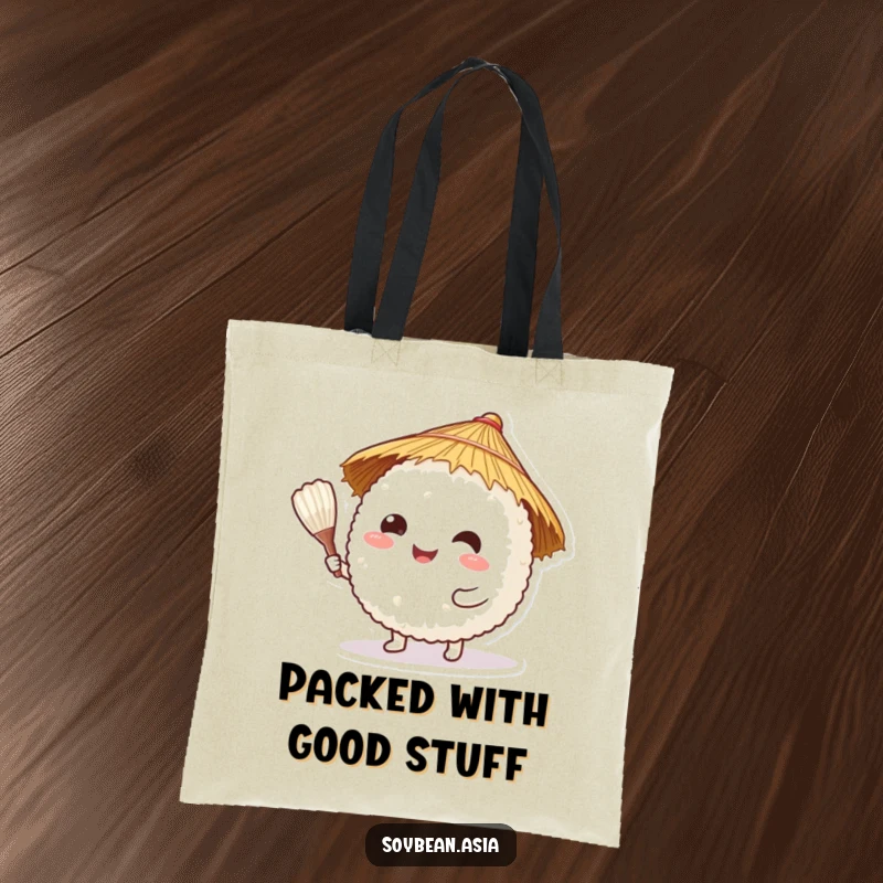 Funny, happy rice ball character in a straw hat, offering a rice paddle on a durable tote bag, for stylish carrying.